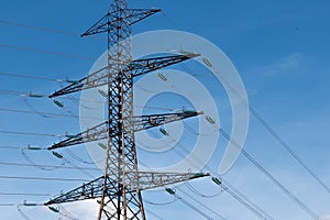 Metal pylon carrying overhead electric cables of high voltage lines