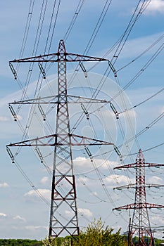 Metal pylons carrying overhead electric cables of high voltage lines