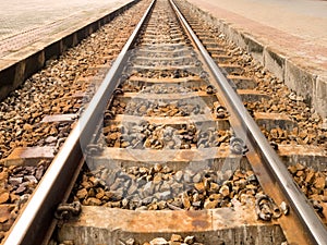 Metal railroad or railway train with rock. Concept of transportation, travel, target, success
