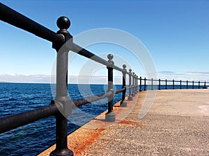 Metal rails on a beachfront