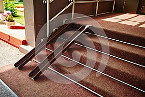 Metal rails for wheelchairs in the doorway of the store. Ramp for accessibility of a person with disabilities
