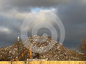 Metal recycling compound showing large heap of rubbish