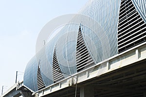 Metal ribbed arch-span roof covering.