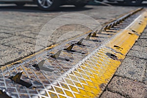 Metal road block that slashes the tires of a vehicle. Outdoor shot. Traveling restrictions.