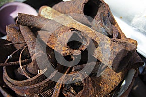 Metal rods. Photo metal surfaces with rust. Diverse old rusty scrap metal from different items close-up. Collection and