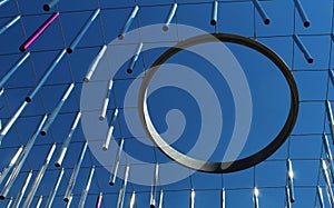 Metal rods and ring hoop hanging against blue sky - modern concept