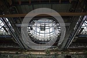 Metal roof construction from the inside with large openings for light. Construction, technology,