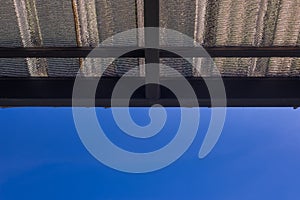 Metal roof sheet with blue sky