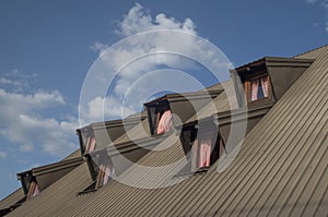 Metal roof with two mansard floors and six windows in Montenegro