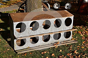 Metal roost with cubicles for chickens to lay eggs