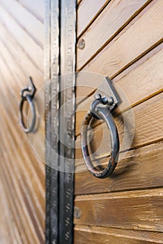 Metal round door handles on wooden door