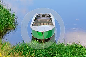 Metal rowboat on the lake