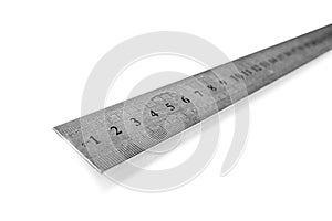 Metal ruler in centimeters or inches. Measuring tool on the white background.