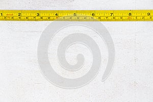 Metal ruler, centimeters and millimeters on the yellow ruler