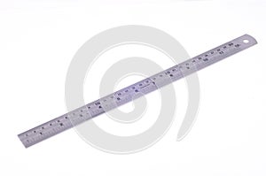 A metal ruler on a white background