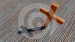 Metal rusted cross on a natural wood or wooden logg background