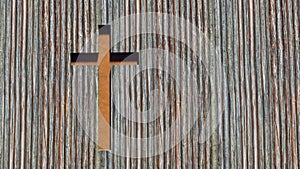 Metal rusted cross on a natural wood or wooden logg background. 3d illustration metaphor for God, Christ