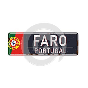 Metal rustet road sign with the name of Faro city from Portugal