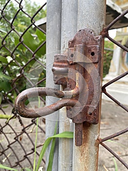 metal rusty gate with a chain
