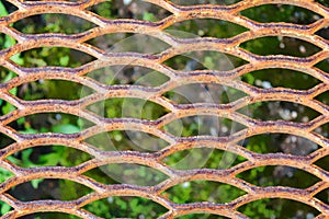 Metal rusty grill. Rustic lattice. Grate for cleaning shoes from metallic lines