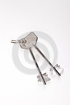 Metal safe keys with key ring on white background