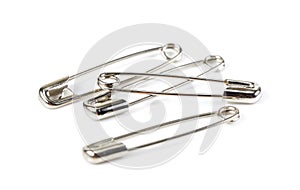 Metal safety pin on white background.