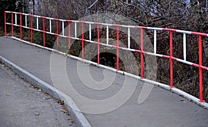 Metal safety road railing at school. protects children from running into the lane of vehicles. it will prevent injuries and fatal