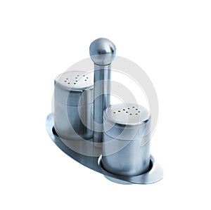 Metal salt and pepper shakers on stand