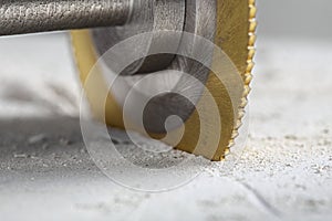 Metal saw, end mill or drill bit with diamond coating makes hole in concrete slab. Industry and construction