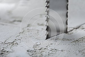 Metal saw, end mill or drill bit with diamond coating makes hole in concrete slab. Industry and construction