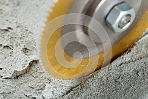Metal saw, end mill or drill bit with diamond coating makes hole in concrete slab. Industry and construction