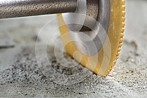 Metal saw, end mill or drill bit with diamond coating makes hole in concrete slab. Industry and construction