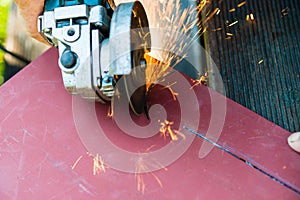 Metal sawing close up with angle grinder
