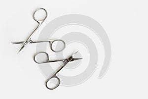 Metal scissors for manicure and pedicure on a white background