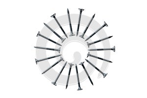 Metal screws arranged in circle on white background