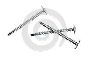 Metal screws isolated on white background closeup. Top view