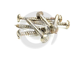 Metal screws on white background