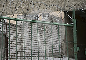Metal security gates in a jail, detail of protection, delinquency and prisoners photo