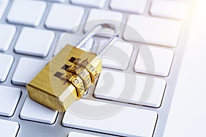 metal security lock with pass-code or password on computer keyboard