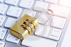 metal security lock with pass-code or password on computer keyboard