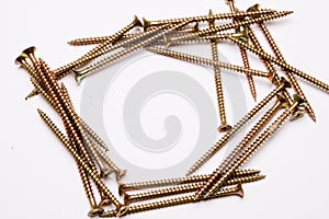 Metal self-tapping screws on a white background