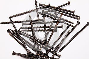 Metal self-tapping screws on a white background