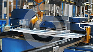 Metal sheet moving on manufacturing line at factory. Production washing machine