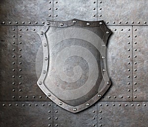 Metal shield over armor plates background