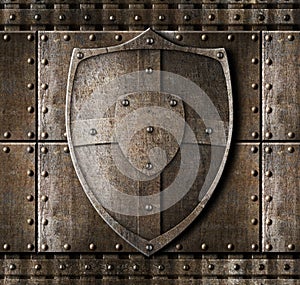 Metal shield over armour background