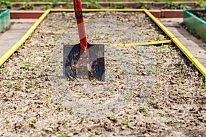 Metal shovel in the ground.