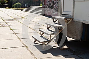 Metal side steps covered with aluminum sheet