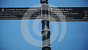 A Metal Sign Post Conveying The Directions Of Thames Path Extension And Thames Path Located In Sout