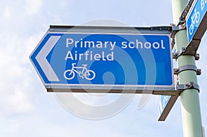 Metal sign post for Primary School, Airfield and cycle path