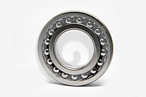 Metal silver ball bearing with balls on white isolated background. Bearing industrial. Part of the car